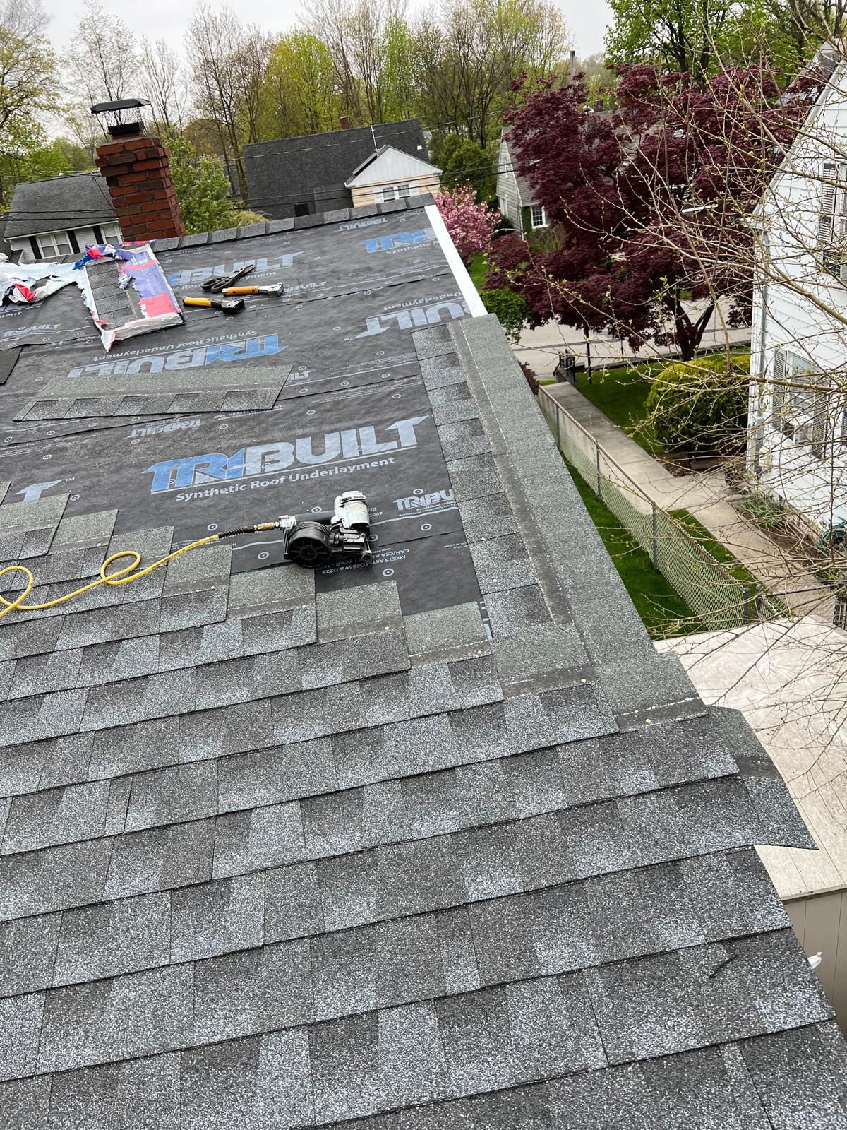GAF Timberline shingles being installed over fresh underlayment